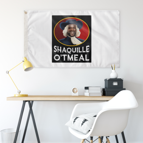 White portrait parody rave flag hanging on wall above a desk with yellow lamp