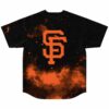 Orange nebula and starfield design on black jersey, back view flat lay