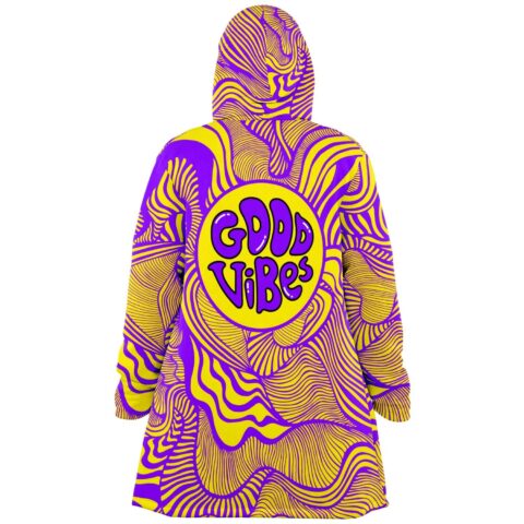 Good Vibes text print on back of psychedelic swirl festival cloak with hood up