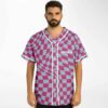Model wearing pink warped checkerboard baseball jersey with white button placket, front view