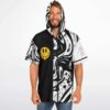 Front view of model wearing black white swirl hoodie jersey with dripping smiley design