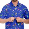 Model adjusting the buttons on the blue dinosaur rave button-down shirt