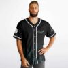 Male model wearing plain black reversible jersey side with white piping and small emblem