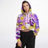Model wearing cropped hoodie with bold vibrant doodle graphics