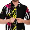 Model buttoning the black rave button-down shirt with vibrant abstract graphics