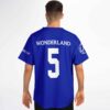 Back view on model showing WONDERLAND number 5 jersey design with compass logo sleeve patch
