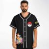 Man wearing black baseball jersey with fox-eared creature pile design and round emblem, front view