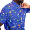 Model wearing the blue dinosaur rave button-down shirt with vibrant graphics