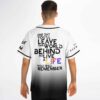 Back view of model wearing rave baseball jersey with remembrance quote in black and rainbow