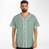 Model wearing sage rave baseball jersey front view with This Never Happened lettering and subtle