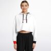 Model in white cropped hoodie displaying front logo and style