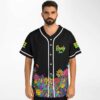 Man wearing black neon mushroom print baseball jersey with Rowdy Town lettering on chest