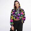 Model wearing vibrant cropped hoodie with mushroom pattern