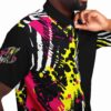Close-up of the rave button-down shirt showing bold pink, yellow and black patterns