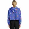 Rear view of person in cropped hoodie with bright dinosaur graphics
