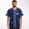model wearing black and blue abstract splatter baseball jersey with Yee chest print