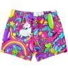 Neon candy collage swim trunks feature a cartoon unicorn and colorful sweets, front product view