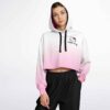Model wearing hoodie with pink ombre and character on front.