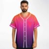Orange pink abstract gradient jersey with pink chest emblem and sleeve patch, front view