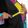 Candy collage cloak close-up reveals plush black lining, bright yellow trim, and patterned zipper edge