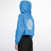 Side angle of blue cropped hoodie displaying floral graphics