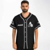 Model wearing black white trim rave baseball jersey with text graphics, model front view