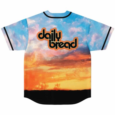Sky-blue photographic sunset jersey with glowing clouds and black horizon, displayed in a back view
