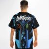 Model wearing black elemental symbols jersey, showing LMNTRIXXX text and blue water back design