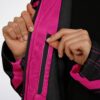 Close-up of cyber cloak zipper showing bright pink trim, black zipper, and plush lining
