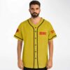 Mustard yellow vintage-washed rose graphic jersey with black piping and red lettering, modeled front view
