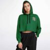 Model wearing green cropped hoodie with pink accent text