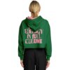 Rear view of model in green cropped hoodie with bold pink text
