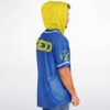 Royal blue anime-inspired warrior jersey with yellow hood and sleeve emblem, modeled from the side
