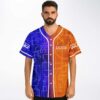 Front-facing model wears split blue and orange geometric circuit pattern with white piping and buttons