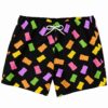 Scattered gummy bear pattern on black swim trunks, front view with white drawstring