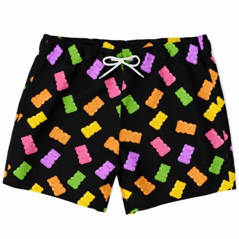 Scattered gummy bear pattern on black swim trunks, front view with white drawstring