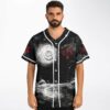Model wearing black-and-white cosmic ocean front, featuring swirling vortex, red elemental symbols, and white piping
