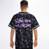 Model wearing gem pattern rave baseball jersey with text on the back, model back view