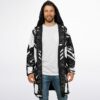 Model wearing a black-and-white cyber circuit cloak, front view with hood and zipper