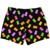 Scattered gummy bear pattern across black swim trunks, back view on white background