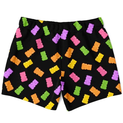 Scattered gummy bear pattern across black swim trunks, back view on white background