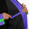 Close-up of geometric alien cloak showing plush black lining, purple trim, and zipper