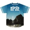 Desert mountain landscape print with bold white festival lettering and glowing accents, sky-blue back view