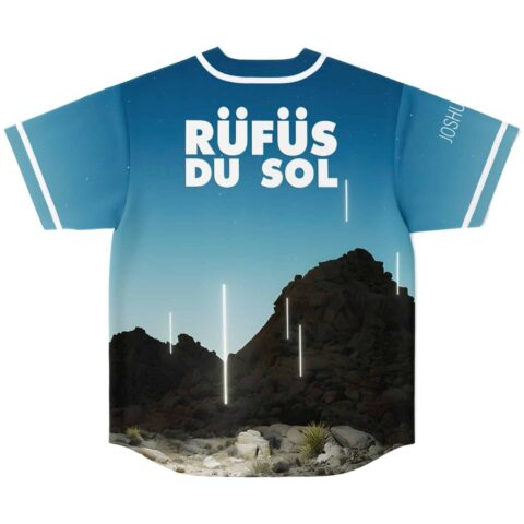 Desert mountain landscape print with bold white festival lettering and glowing accents, sky-blue back view