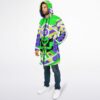 Person wearing a zipped geometric alien cloak in a three-quarter studio view