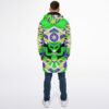 Person modeling the geometric alien-patterned cloak from behind with centered alien face design