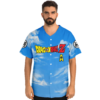 Sky blue cloud print with bold multicolor lettering and yellow emblem, modeled front view