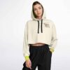 Model in the cream bass bitch rave cropped hoodie with lime cuffs