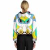 Model back view of the trippy rave cropped hoodie with whimsical teal and yellow patterns across the back
