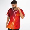 Angled model view of fiery red gradient jersey with golden emblem and button front